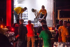 Scientology Volunteer Ministers Unloading Disaster Relief Supplies
