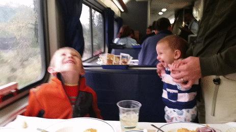 Two of my kids having a good laugh in the Amtrak dining car.