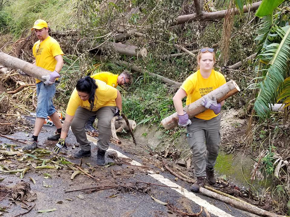 Working with the local army to clear debris from a road in Puerto RicoWorking with the local army to clear debris from a road in Puerto Rico